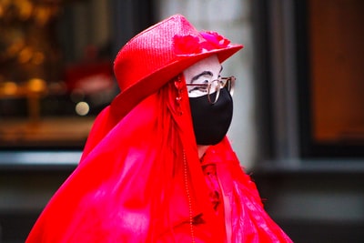 Wear a red hoodie, a black mask
